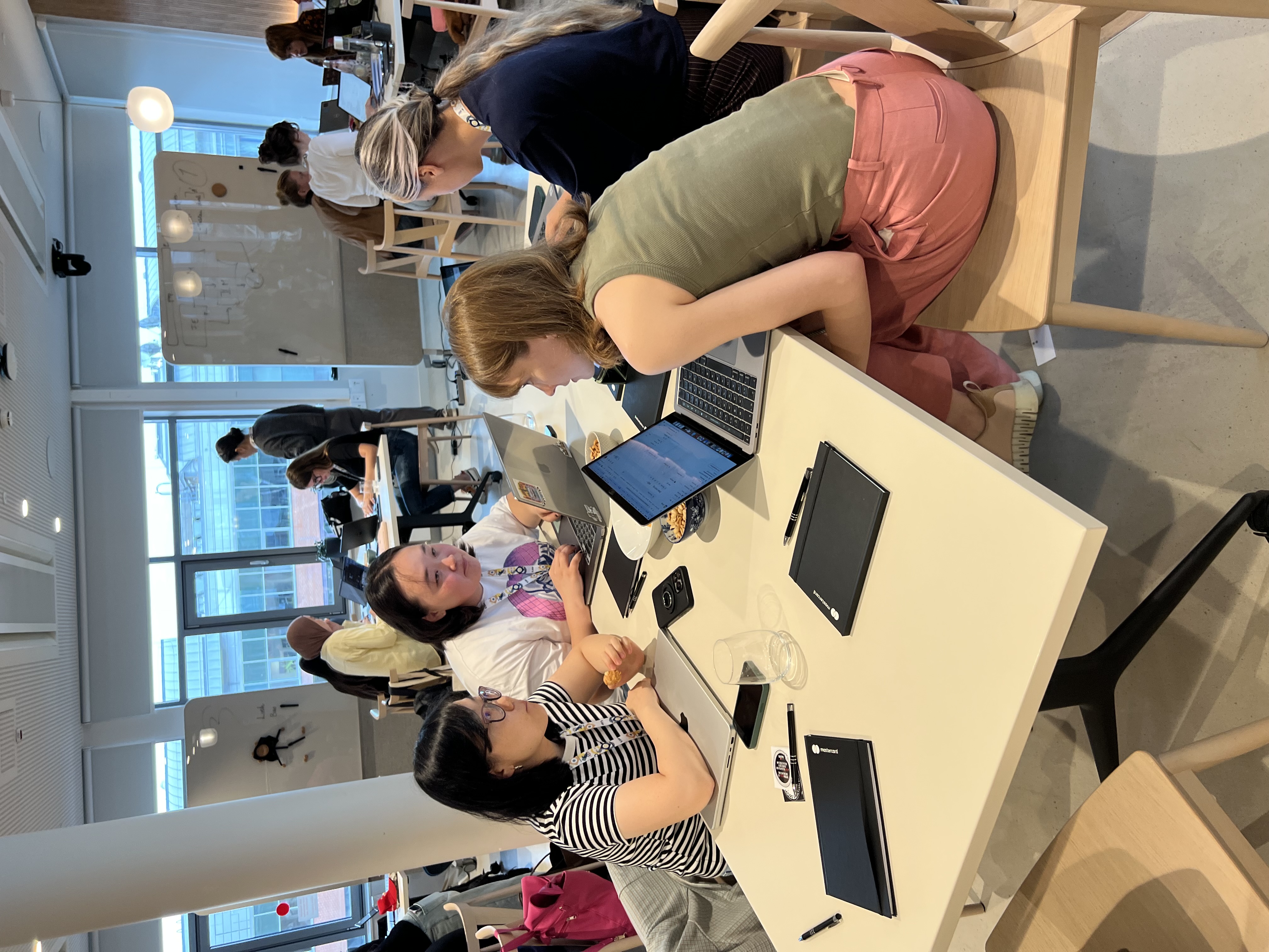 Participants working at WiDS Budapest Datathon